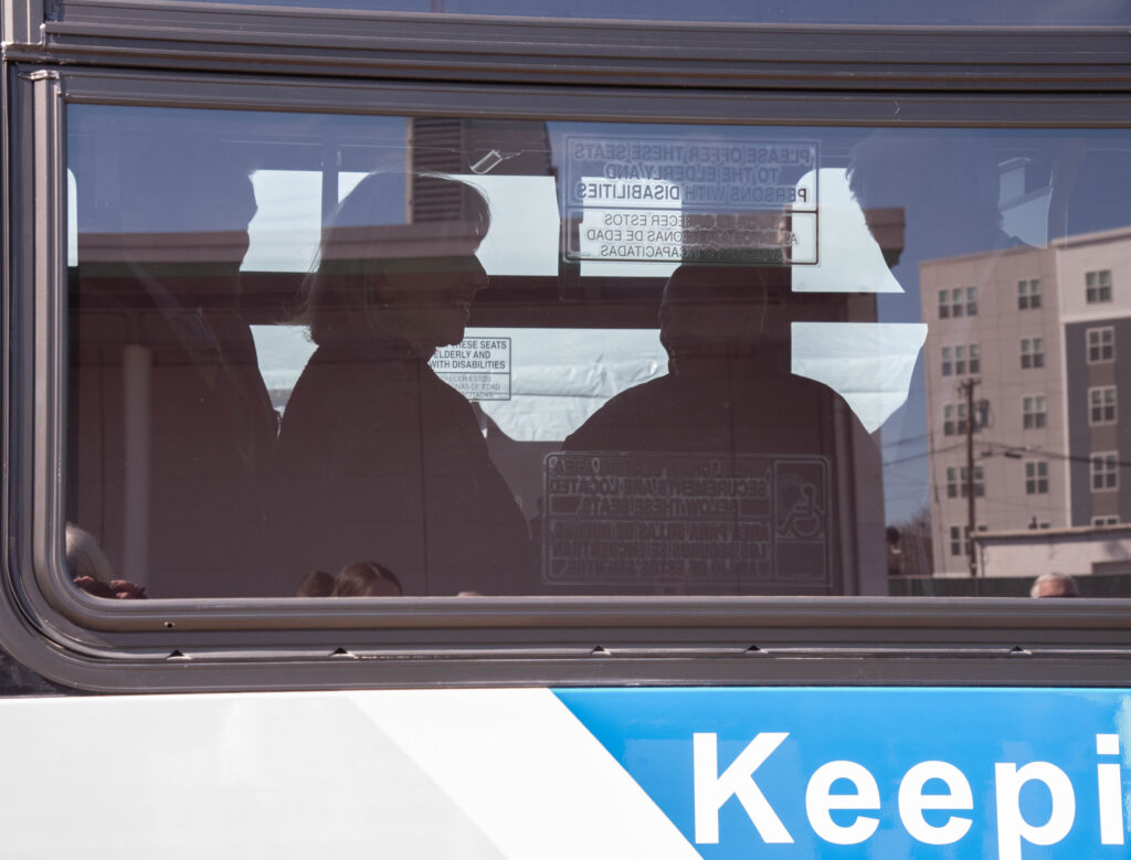 Silhouette view of Senate President Karen Spilka and Transportation Secretary Monica Tibbits-Nutt thru the window