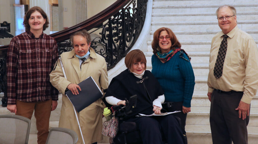 people posing at the staircase